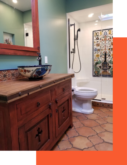 A bathroom with a sink, mirror and toilet.